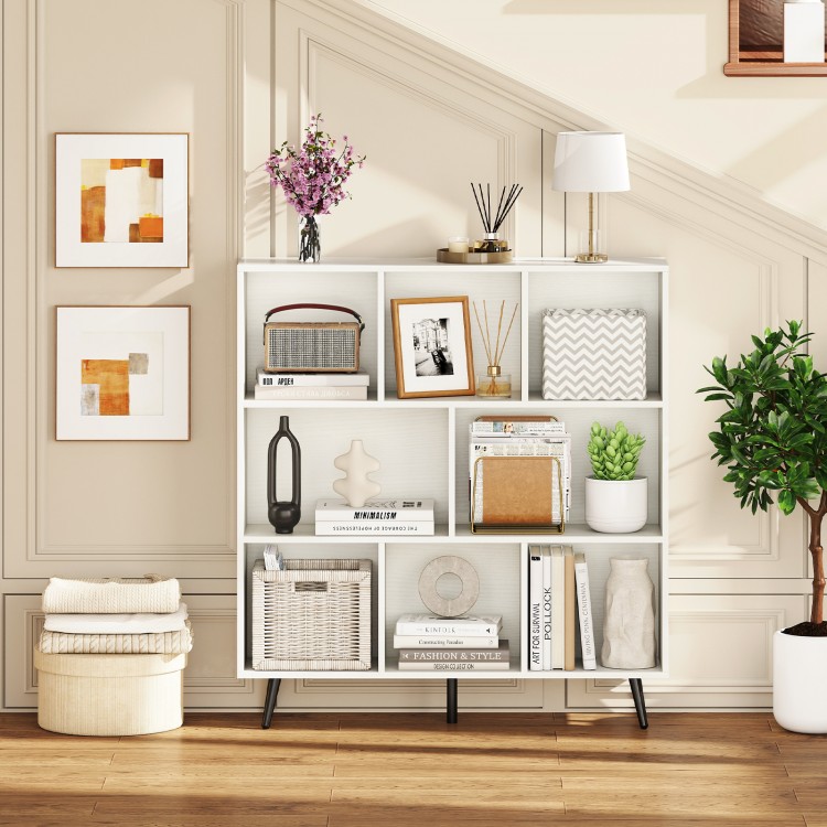 8-cube bookcase in white with 5 tapered metal legs, ideal for organizing books and decor in any living space.