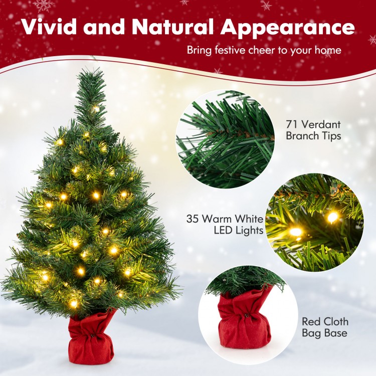 24-inch mini pre-lit Christmas tree with 35 warm white LED lights and red cloth bag base, perfect for festive tabletop.