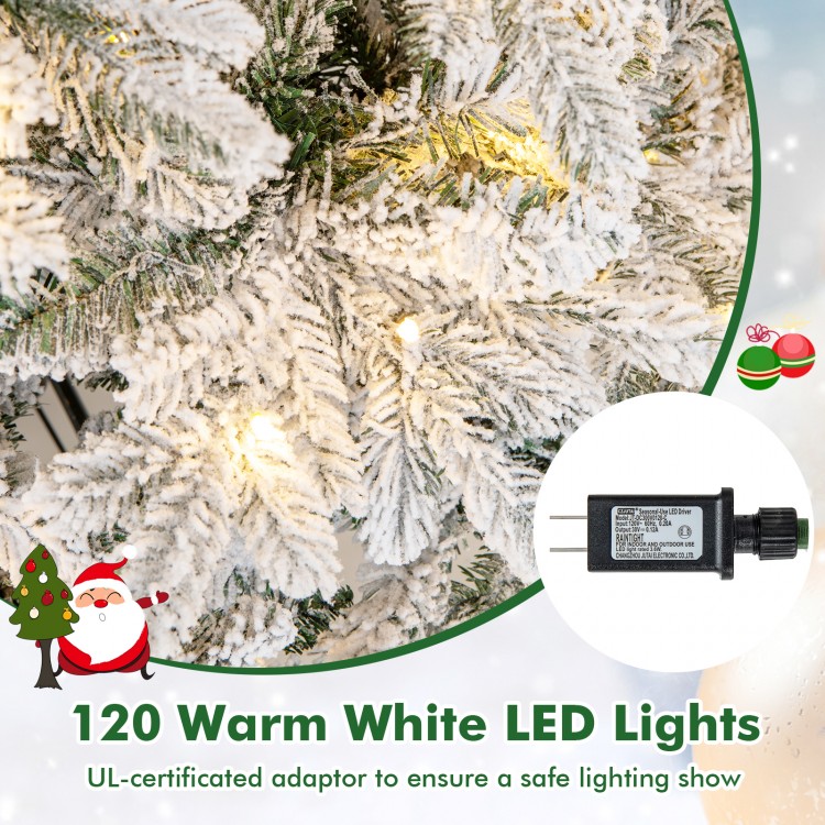 Flocked Christmas tree with 120 warm white LED lights, featuring a stable metal stand and realistic branch tips.