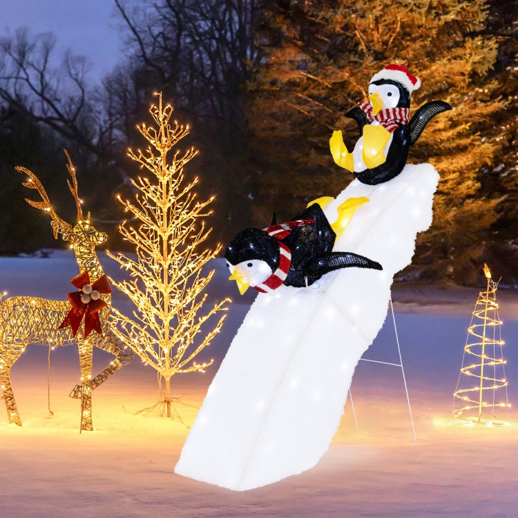 4 feet Christmas penguin decor on snowy slide with 130 LED lights, perfect for festive indoor or outdoor holiday.