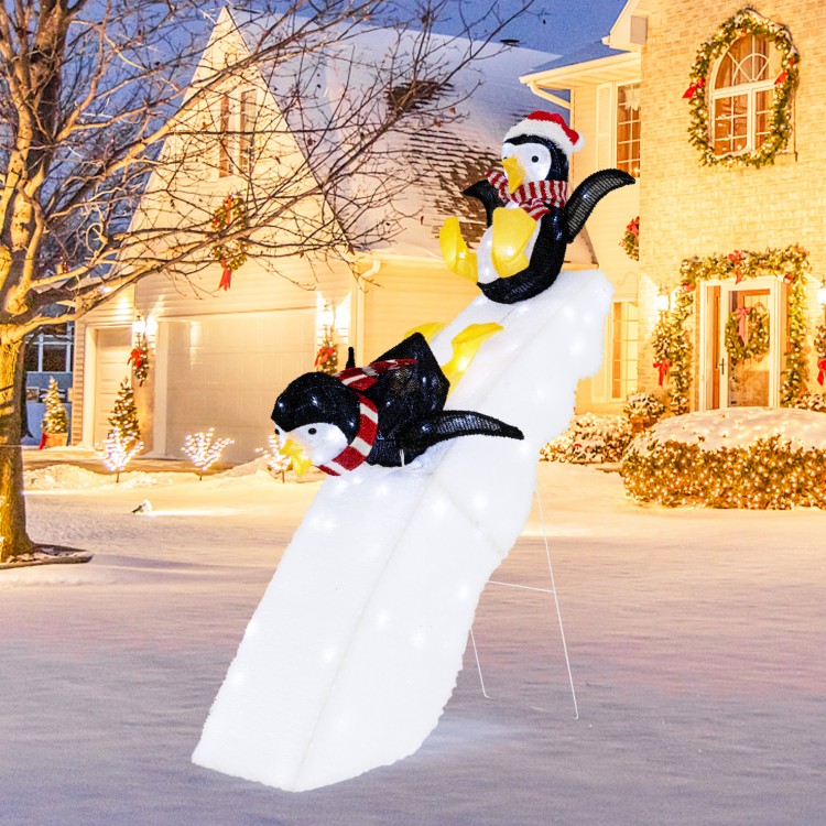 4 feet Christmas penguin decor with snowy slide, featuring 130 LED lights for festive outdoor holiday cheer.