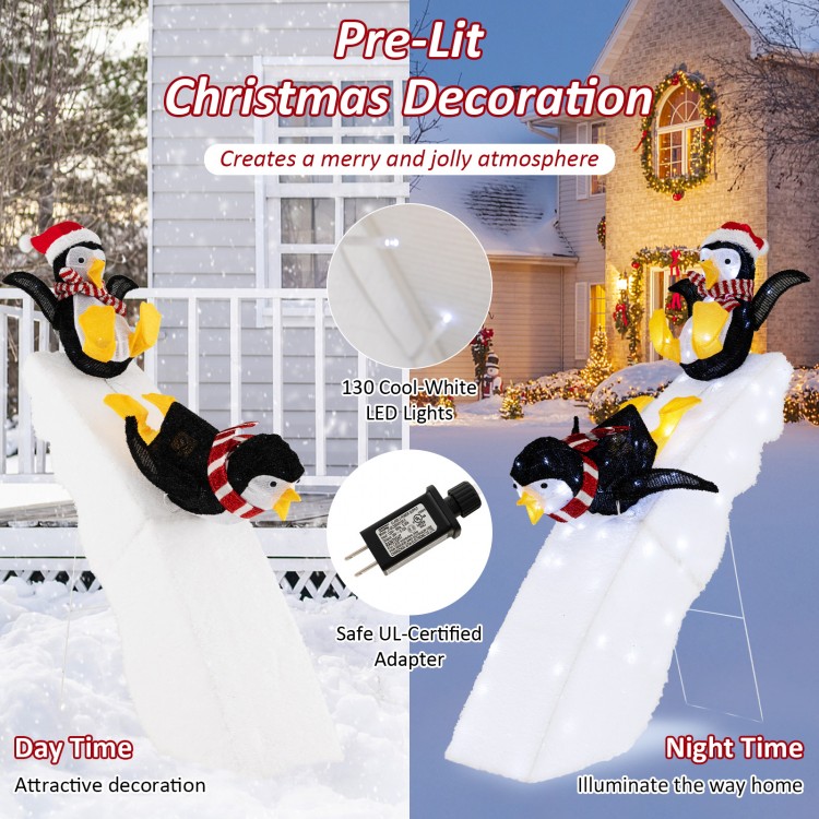4 feet Christmas penguin ice skating decor with snowy slide, featuring 130 cool-white LED lights for festive outdoor.