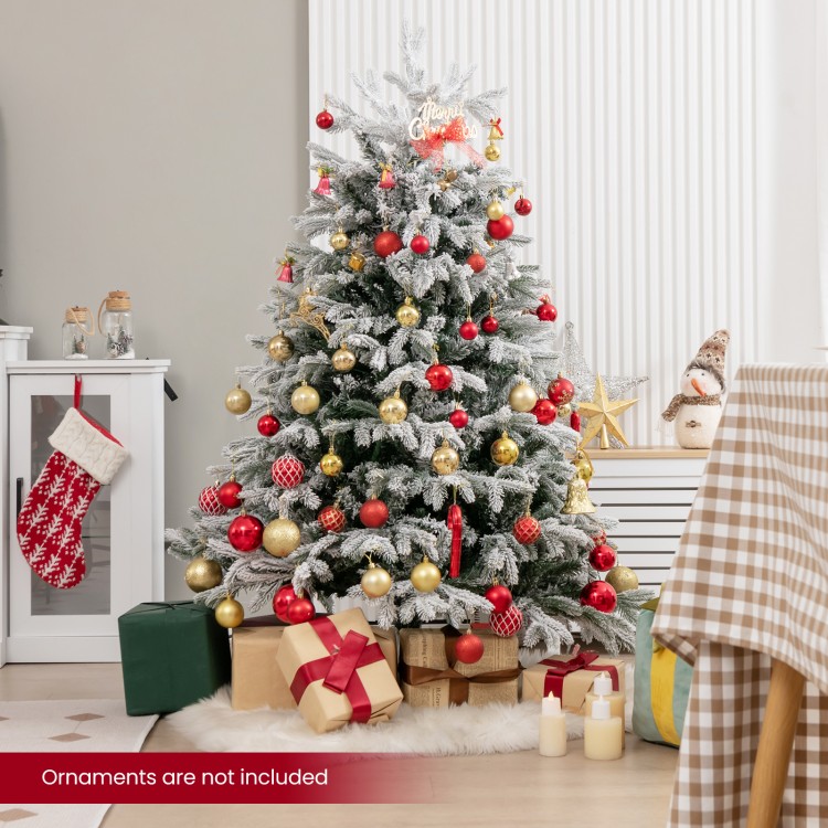 Snowy 4.5 ft artificial pre-lit Christmas tree with warm white LED lights, perfect for holiday decorating at home.