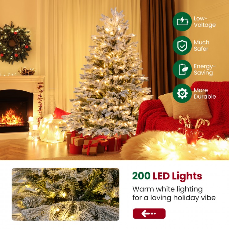 4.5 ft artificial pre-lit Christmas tree with 200 warm white LED lights, featuring snowy flocking for a festive.