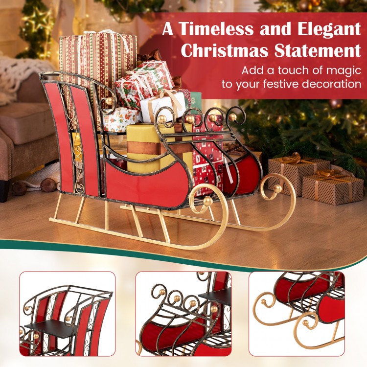 Christmas metal sleigh decoration in vibrant red with black and gold scrollwork, featuring a 2-tier storage shelf for.