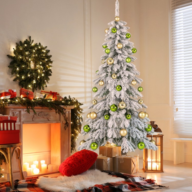 6 feet artificial Xmas tree with snowy flocking, 589 branch tips, and 48 colorful Xmas balls for festive decor.