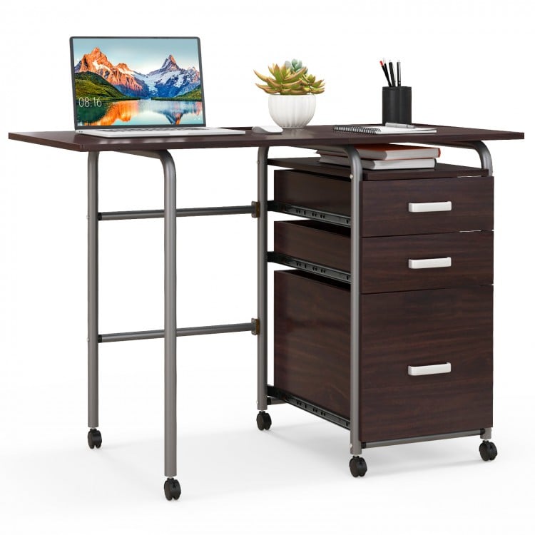 Folding brown computer desk with three drawers and wheels for easy movement, ideal for home office or limited spaces.