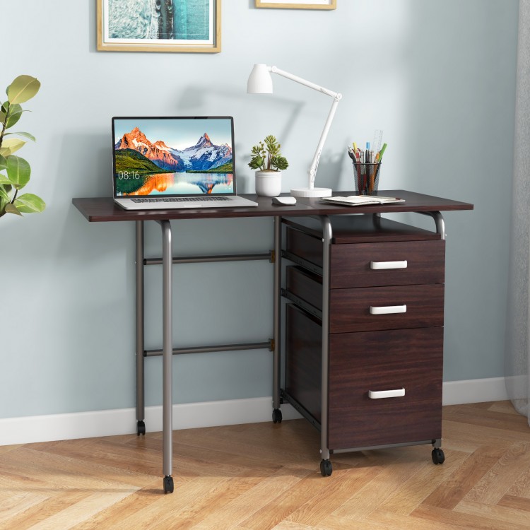 Brown folding computer desk with three drawers and wheels, ideal for home office or limited spaces.