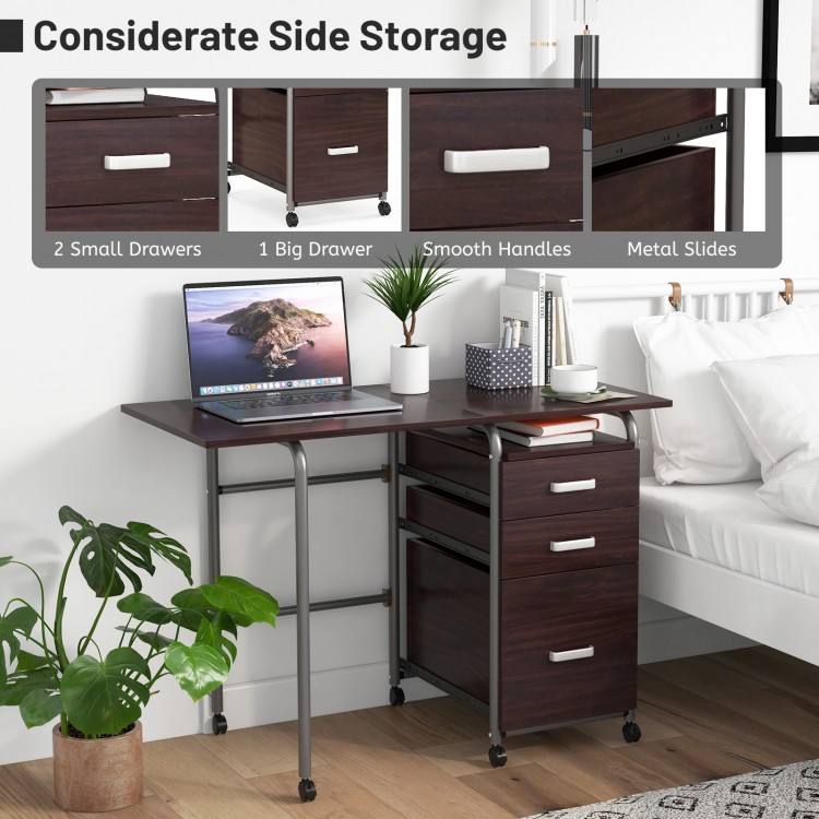 Folding brown computer desk with three drawers and wheels, ideal for home office or small spaces.