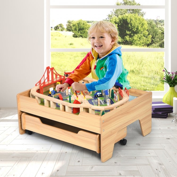 Kids wooden train set table with 100 colorful pieces, featuring lockable wheels and sturdy legs for safe play.