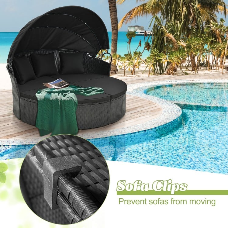Sofa clips securing the black Clamshell Patio Daybed, ensuring stability and preventing movement for outdoor use.