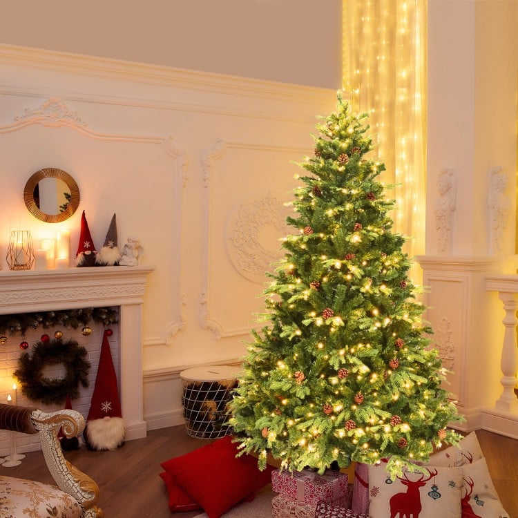 7' artificial Christmas tree with LED lights and pine cones, featuring hinged branches for easy setup, perfect for.