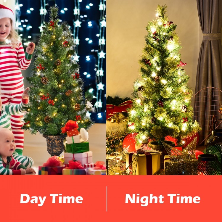 3-foot LED Christmas entrance tree illuminated at night, adorned with red berries and pine cones for festive charm.