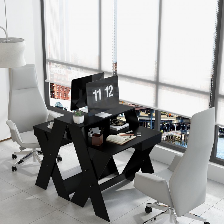 Small black computer desk showcasing a practical storage drawer and raised monitor stand, perfect for efficient.