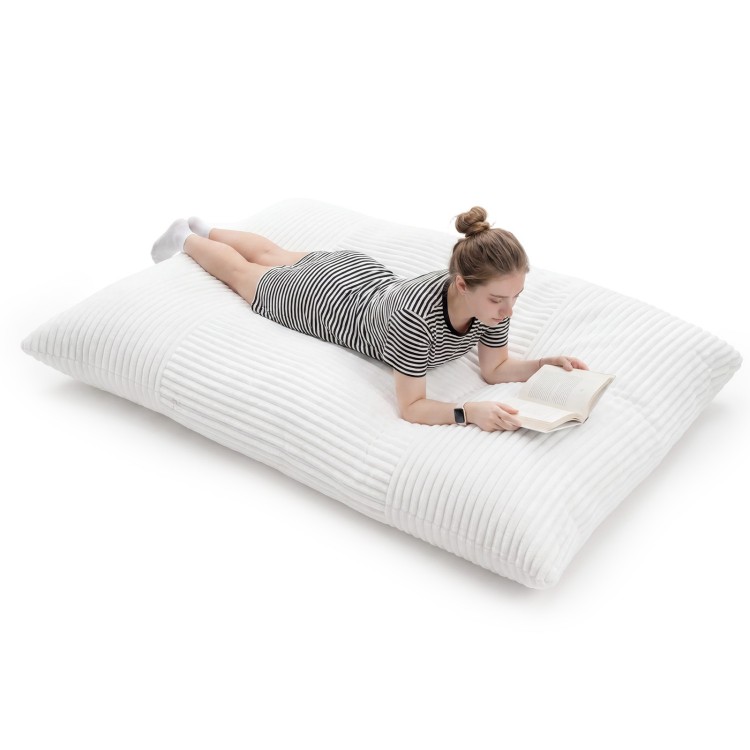 Convertible bean bag floor sofa in beige with a corduroy cover, perfect for reading or napping at home.