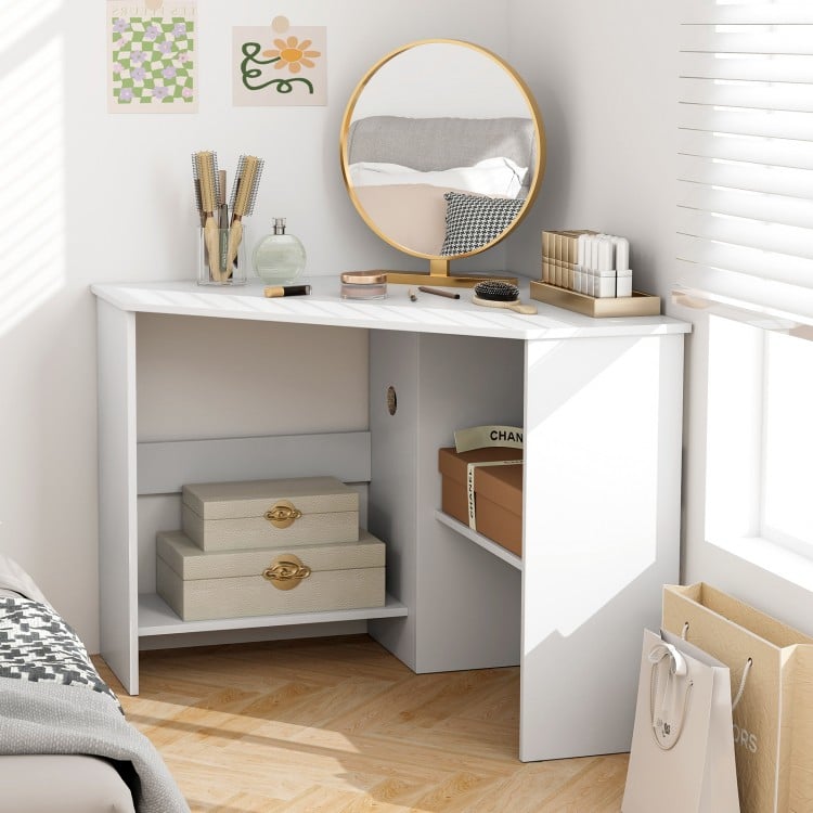Corner computer desk in white with triangle design, spacious tabletop, and storage shelves for organized workspace.