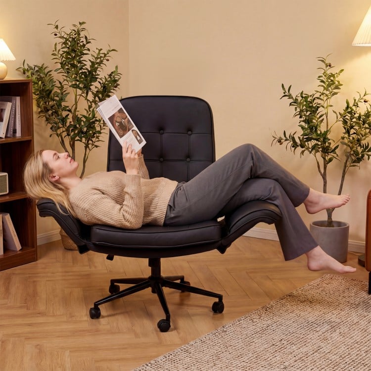 Adjustable black Criss Cross Chair with thick padding and 5-position armrests, perfect for reading and relaxation.