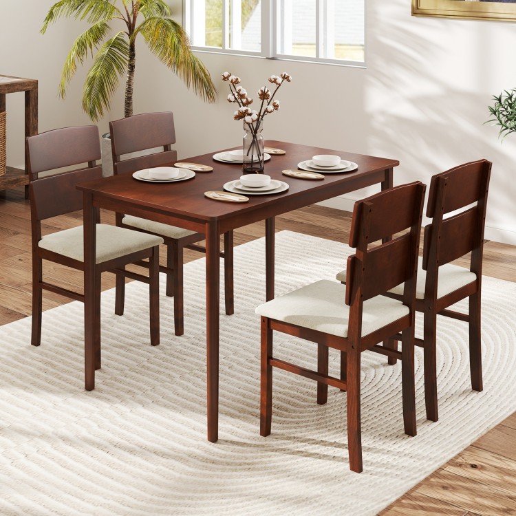 Walnut dining table set with a sleek veneered MDF tabletop and four chairs, offering a stylish and inviting dining.