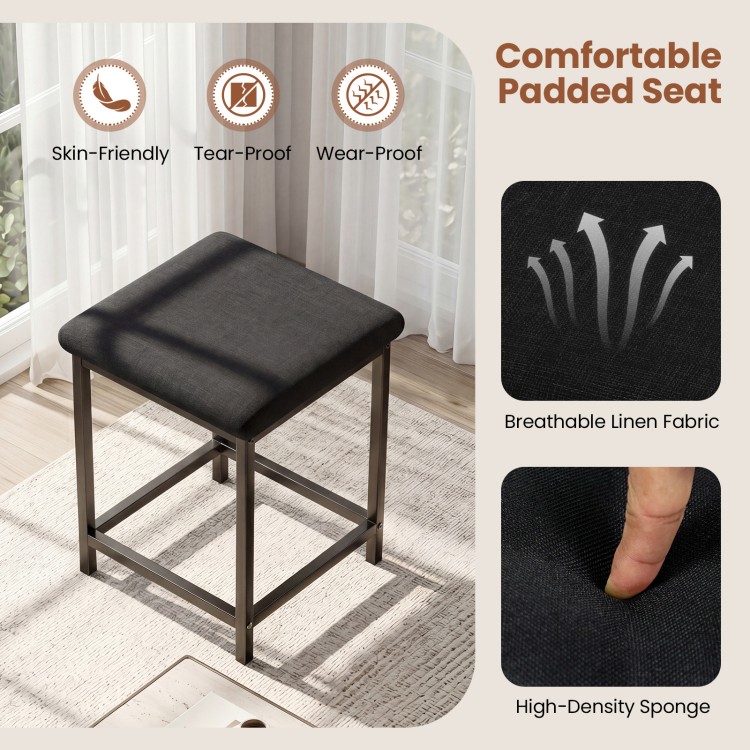 Upholstered stool with padded seat in breathable linen fabric, featuring a sturdy metal frame for dining table set.