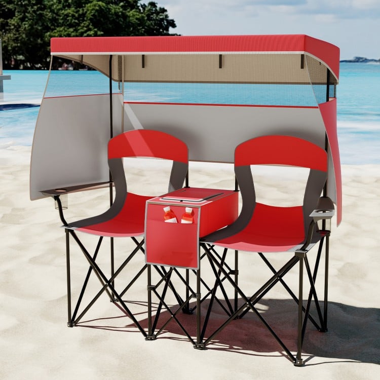 Double beach chair with adjustable canopy in red, featuring side shades, cup holders, and a central cooler bag for.