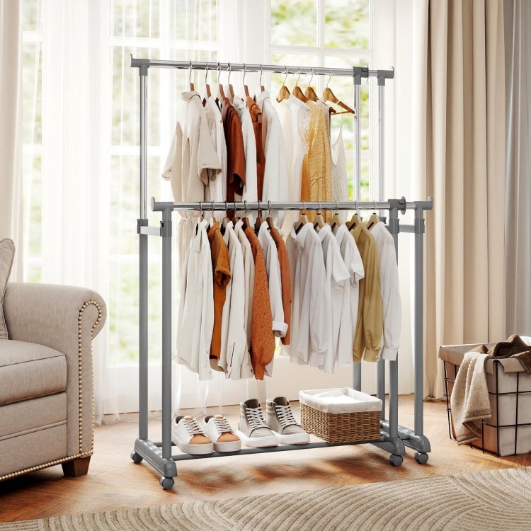 Double rod clothes rack in a living room, featuring adjustable height and extendable width for versatile storage.
