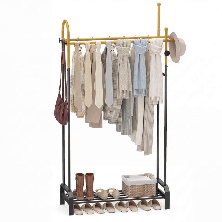 Double rods garment rack in gold and black with hanging clothes, side hooks, and bottom shelf for shoes and accessories.