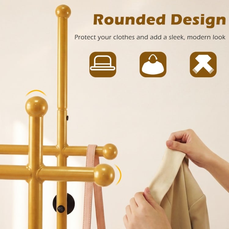 Double rods garment rack in gold with rounded design, featuring hooks and a bottom shelf for stylish storage.