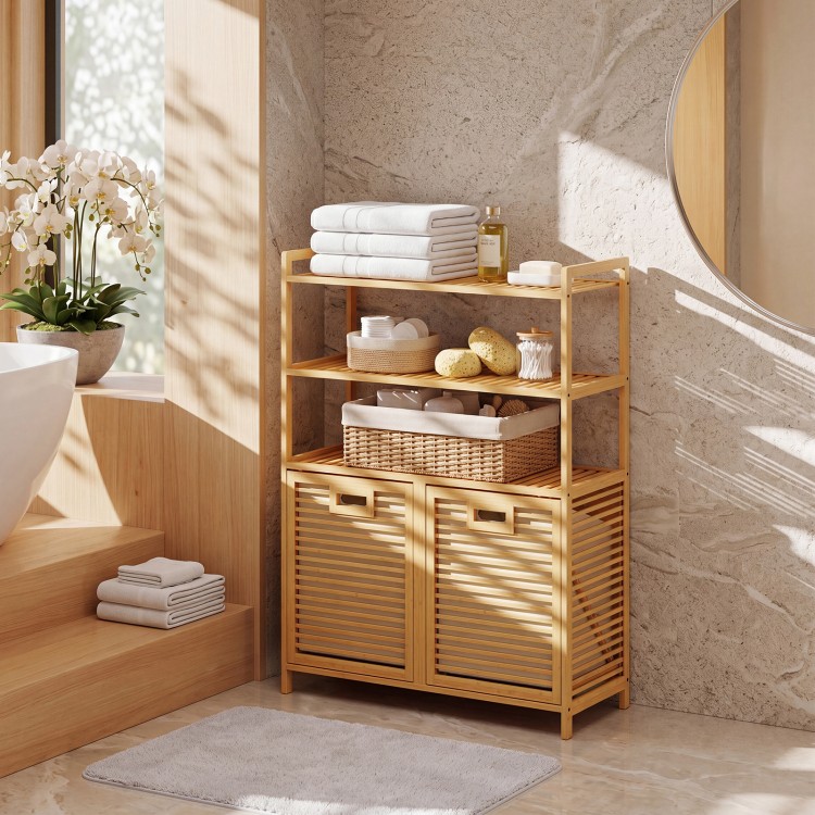 Natural bamboo double tilt-out laundry hamper with three shelves and two removable baskets for organized storage.