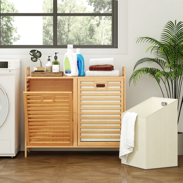 Double tilt-out laundry hamper in natural bamboo with two removable bins and top shelf, perfect for laundry room.