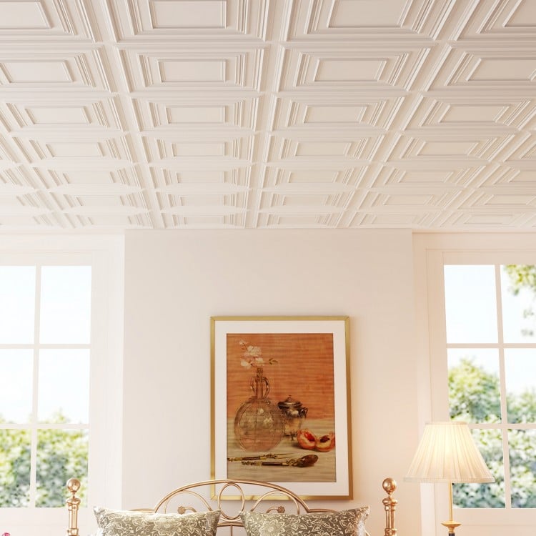 White 3D decorative drop ceiling tiles in a room setting, showcasing a modern design for versatile installation.