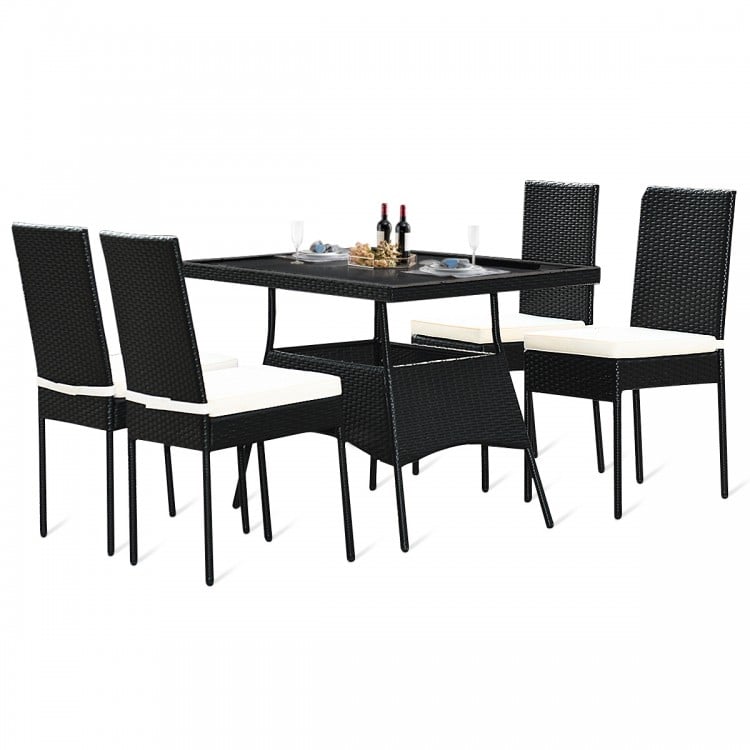 5-piece outdoor patio rattan dining set with glass top, featuring 4 chairs with cushions, perfect for family gatherings.