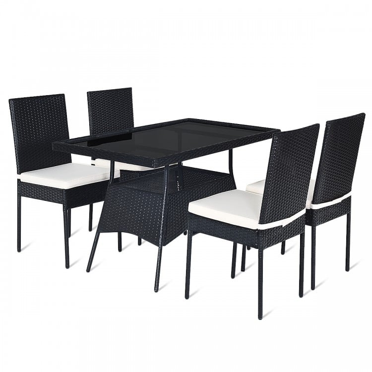 Tabletop close-up of the 5-piece outdoor patio dining set, featuring a smooth tempered glass surface and sturdy rattan.