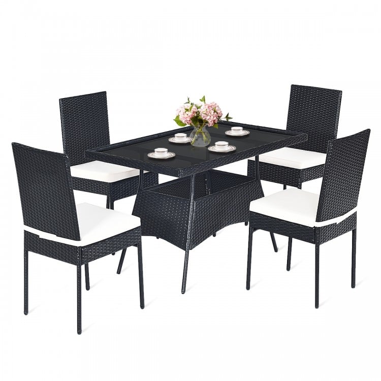 5-piece outdoor patio rattan dining set with glass top and cushions, perfect for family gatherings and outdoor use.