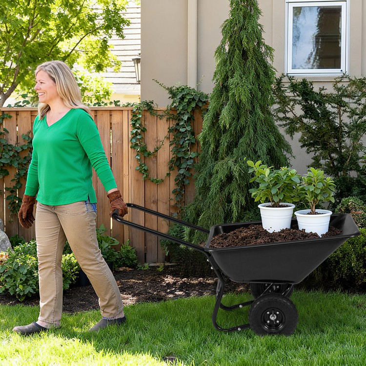 Dual-wheel wheelbarrow cart with pneumatic tires, transporting soil and plants in a garden setting for easy.