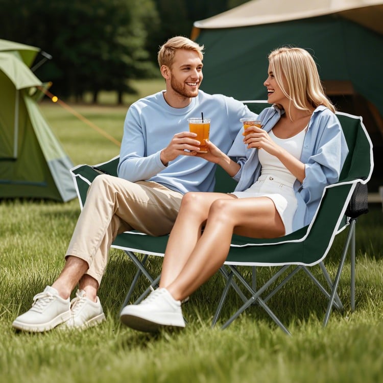 Duo camping chair in green, featuring armrests and cup holders, perfect for outdoor relaxation at parks or beaches.