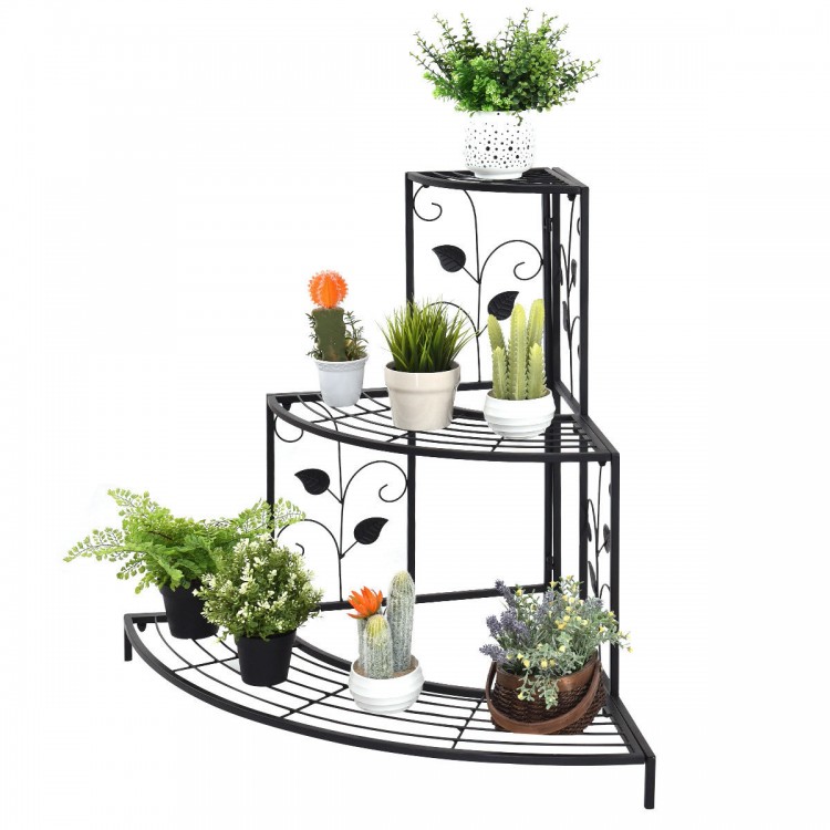 Three-tier floral corner metal plant pot rack in black, ideal for displaying potted plants and decorative items.