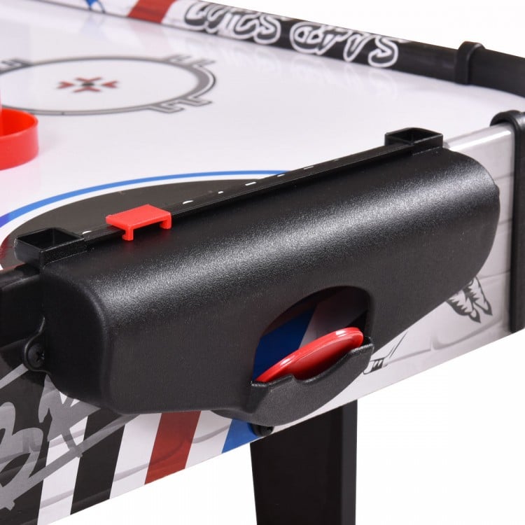 Close-up of the scoring system on a 42-inch air hockey table, featuring pushers and electronic scorekeeping.