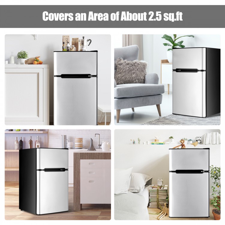 Compact stainless steel refrigerator with adjustable thermostat and freezer compartment, ideal for small spaces.