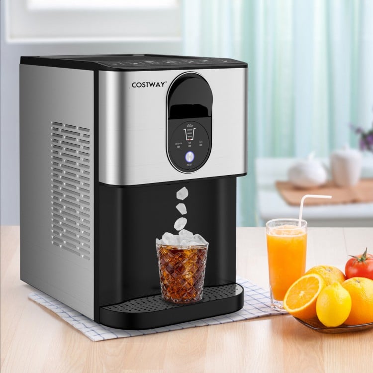 Self-dispensing nugget ice maker in silver, producing chewable ice cubes for refreshing drinks on a countertop.