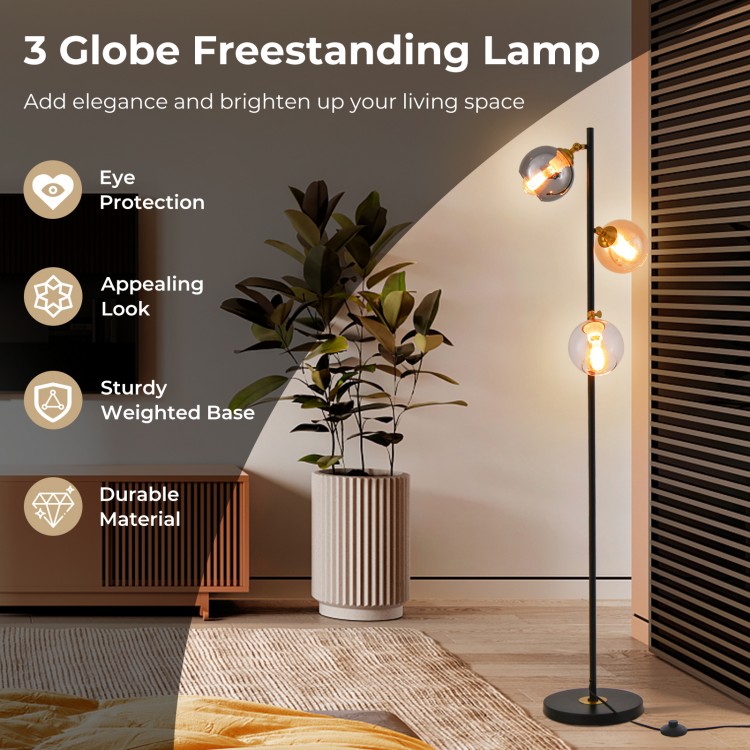 Mid Century floor lamp with 3 glass globe lampshades and sturdy weighted base, perfect for elegant living spaces.