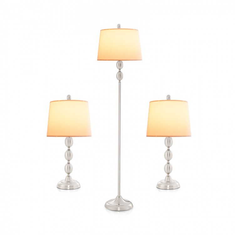 Three-piece table and floor lamp set with metal construction and soft glow, perfect for modern interiors.