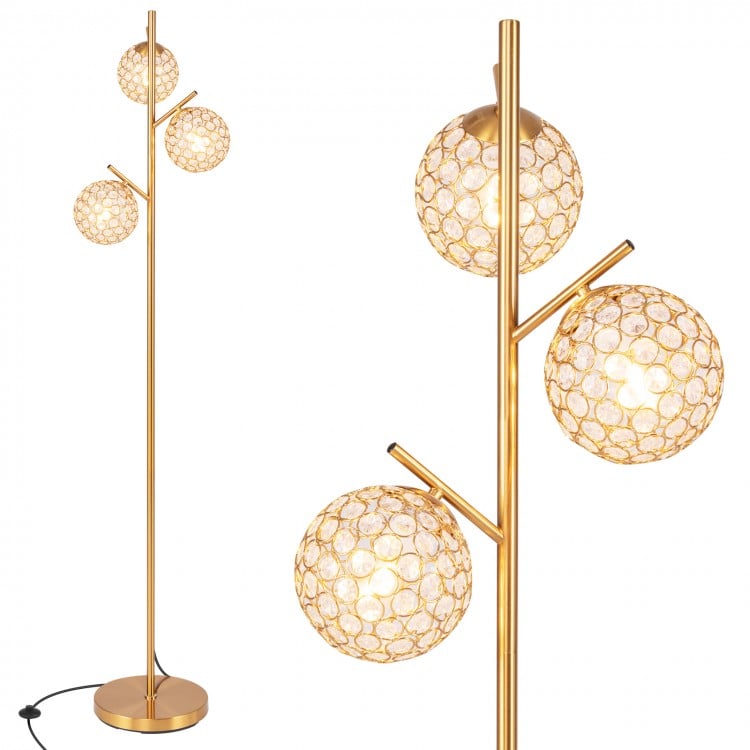 Three-globe floor lamp in gold with acrylic shades, foot switch, and sturdy base for stylish home or café lighting.