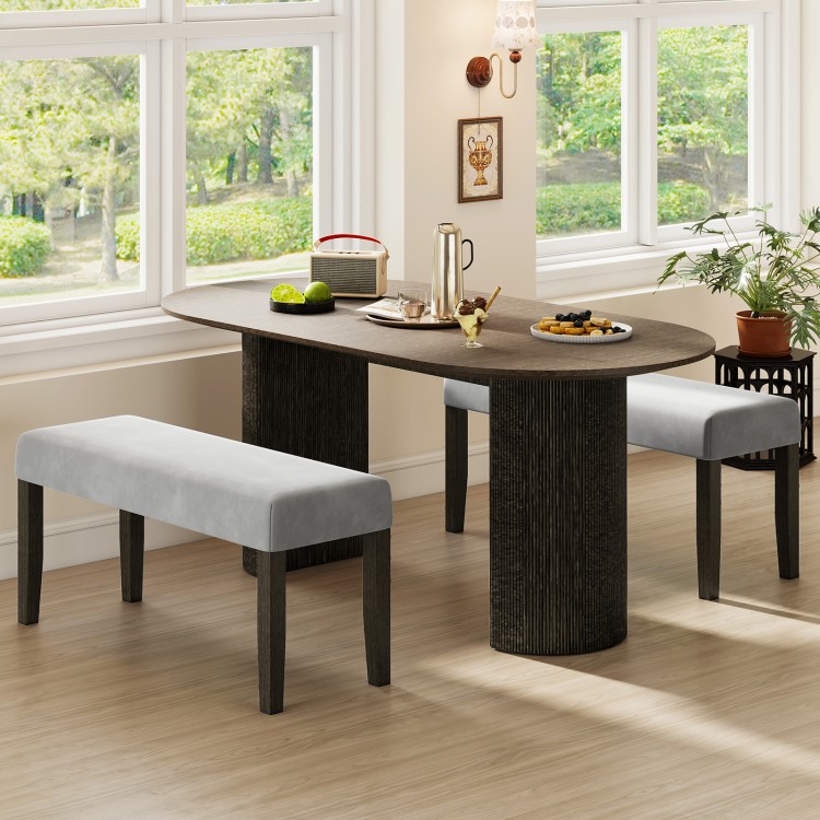 Gray end of bed bench with padded velvet seat and solid wood legs, perfect for bedroom or entryway seating and storage.