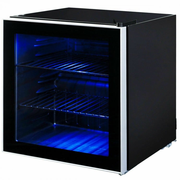 Mini beverage refrigerator with glass door, 60-can capacity, chrome shelves, and interior LED light for easy access.