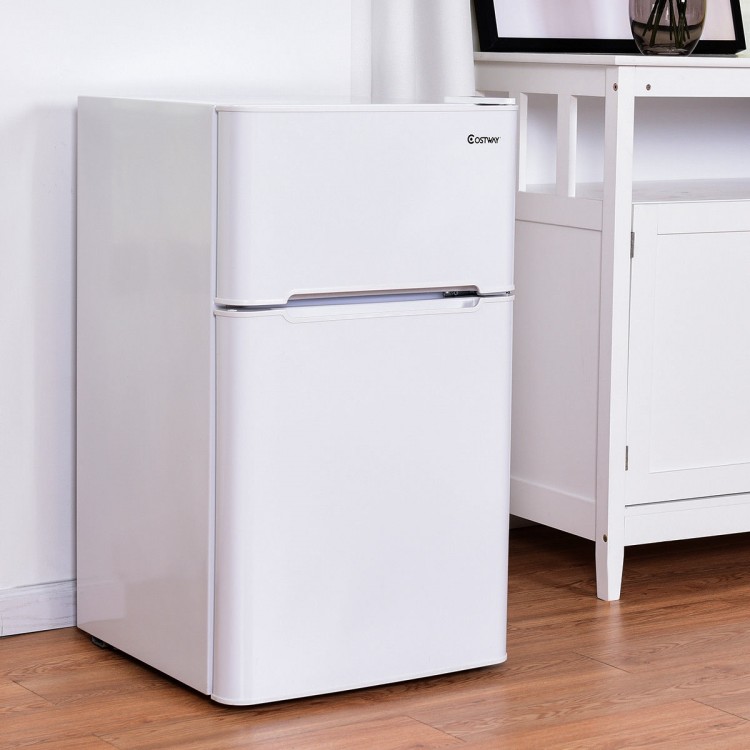 Compact 3.2 cu ft. stainless steel refrigerator in white with adjustable shelves and separate freezer compartment for.