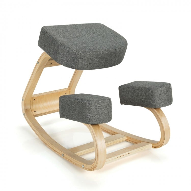Ergonomic gray kneeling chair with curved wooden base, designed for upright posture and comfort, suitable for home or.