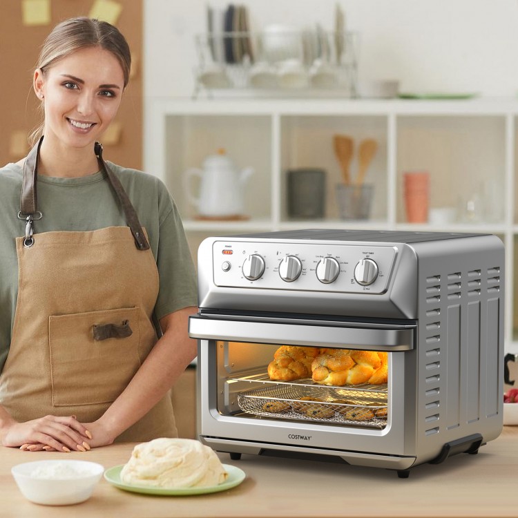 21.5 Quart stainless steel air fryer toaster oven with see-through door, cooking for family-sized meals.