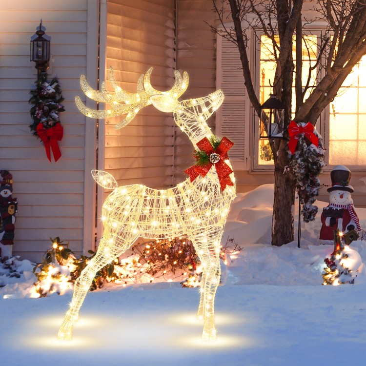 Lighted standing reindeer with 120 LED bulbs, festive bow, perfect for outdoor Christmas decoration.