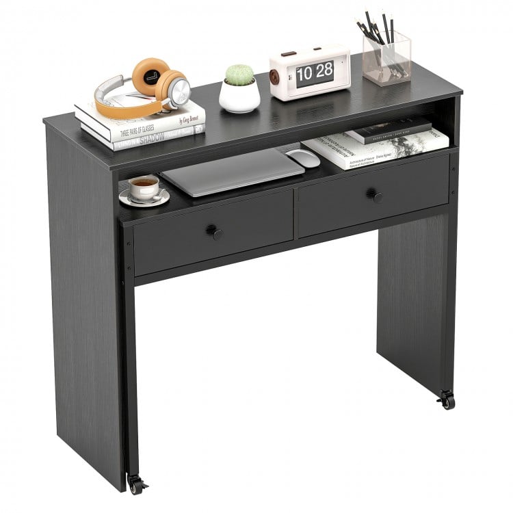 Extendable black computer desk with two storage drawers, monitor shelf, and lockable wheels for versatile home office.