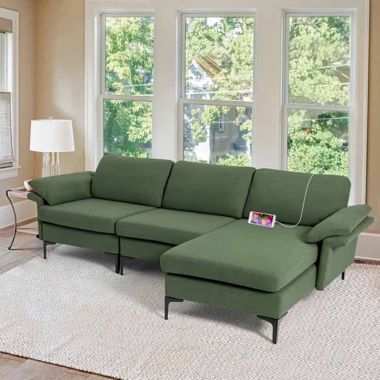 Reversible chaise of the extra large army green sectional sofa, featuring soft linen upholstery and hidden storage for.